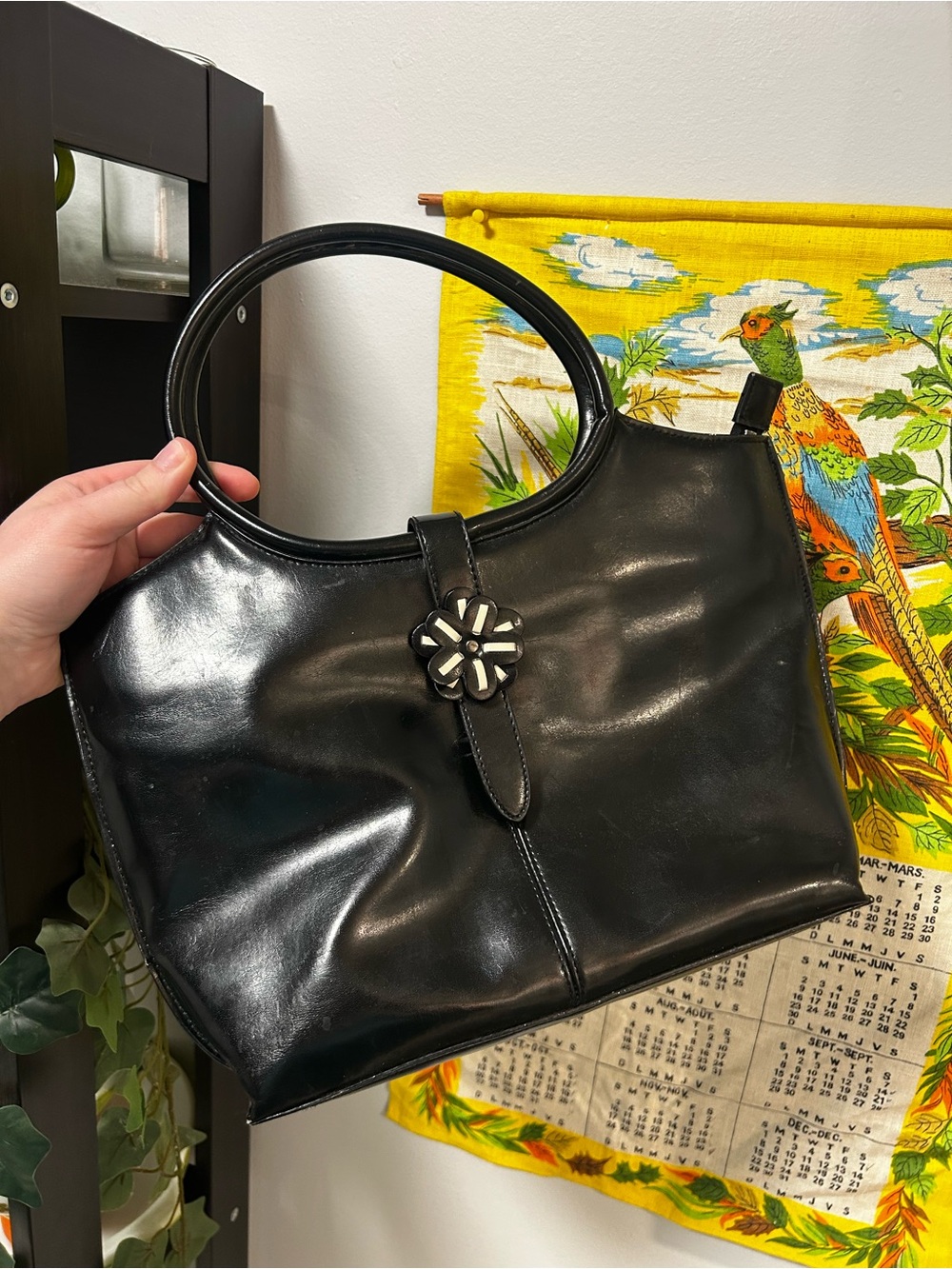 Black Patent Leather Handbag with Floral Accent